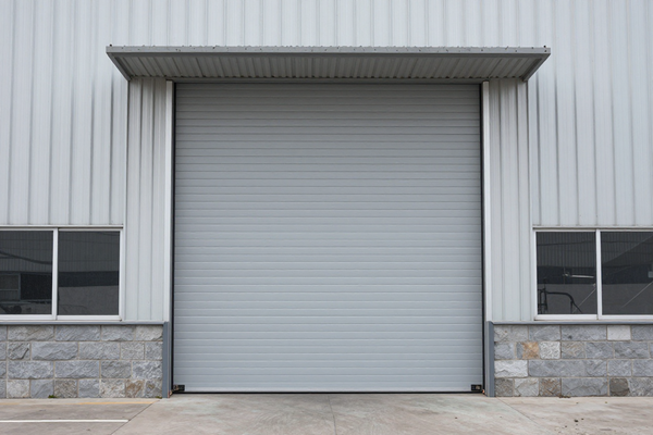 Industrial warehouse automatic sectional door, large format, grey tones